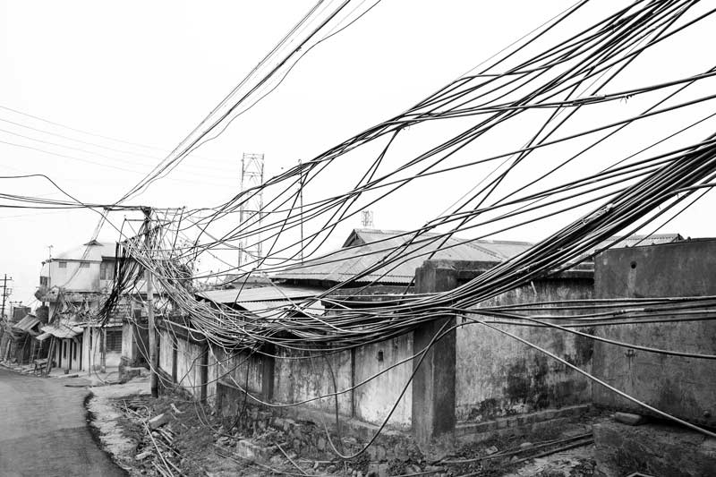 Kohima: The City of Water Cables - bunch of water cables running across a long row of houses in one of the localities of Kohima